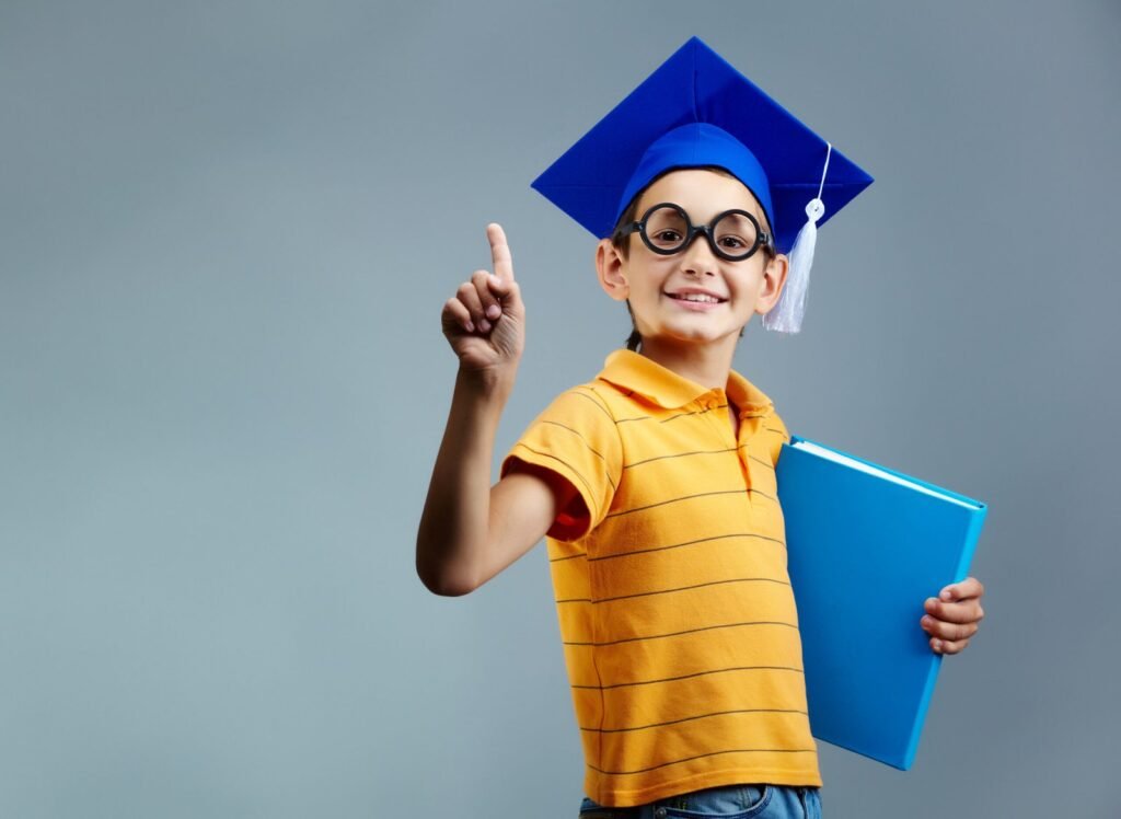 proud little boy with glasses graduation cap scaled 1